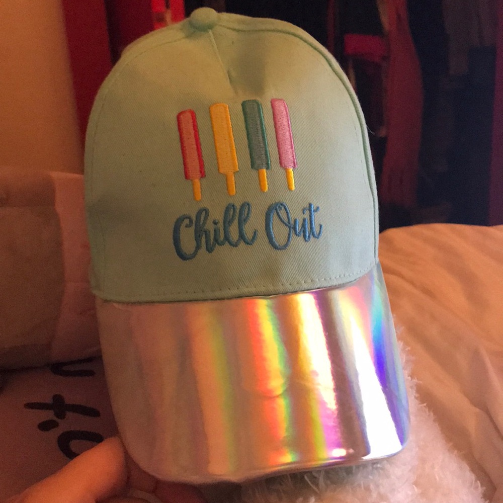 A mint colored cap that says “Chill Out” on it.